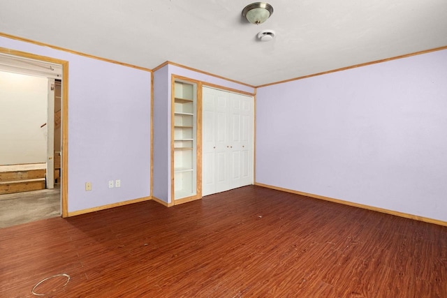 525 Hercules Trl, Madison, WI 53718 - unfurnished bedroom featuring crown molding, wood finished floors, and a closet