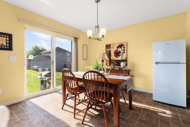 525 Hercules Trl, Madison, WI 53718 - dining space featuring a chandelier and stone finish floors