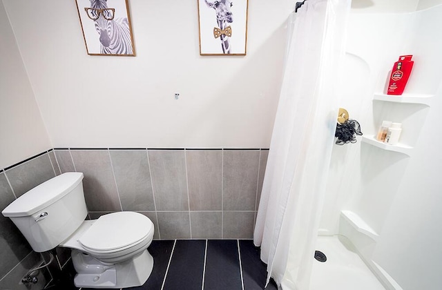 11812 Fox River Rd, Twin Lakes, WI 53181 - bathroom with tile walls, tile patterned floors, a shower with curtain, and wainscoting