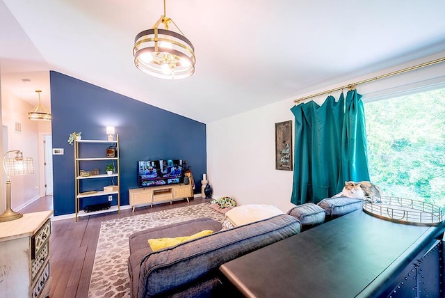 11812 Fox River Rd, Twin Lakes, WI 53181 - living room with lofted ceiling, wood-type flooring, and a chandelier
