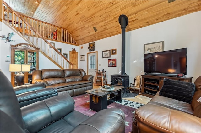 9926 W Birch Circle Dr, Ladysmith, WI 54848 - living room featuring wooden ceiling, a wood stove, stairs, and high vaulted ceiling