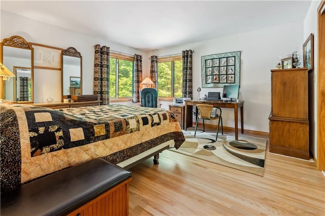 9926 W Birch Circle Dr, Ladysmith, WI 54848 - bedroom with wood finished floors and an office area