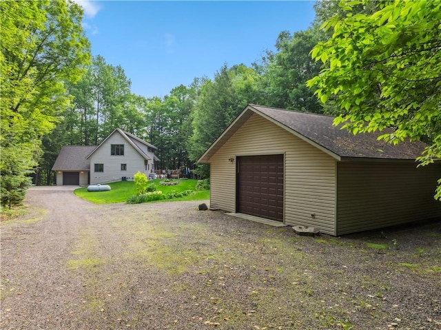 9926 W Birch Circle Dr, Ladysmith, WI 54848 - detached garage featuring view of wooded area
