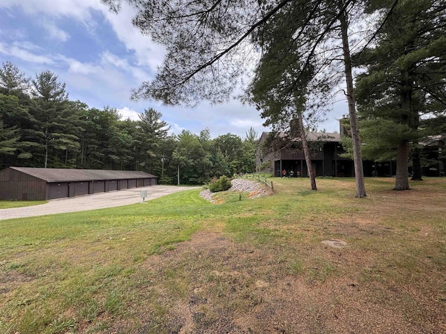 8 Balsam Trl, Wisconsin Dells, WI 53965 - view of grassy yard featuring a pole building and an outdoor structure