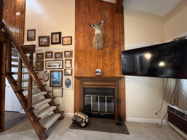 8 Balsam Trl, Wisconsin Dells, WI 53965 - living area with stairway, carpet, and a fireplace with flush hearth