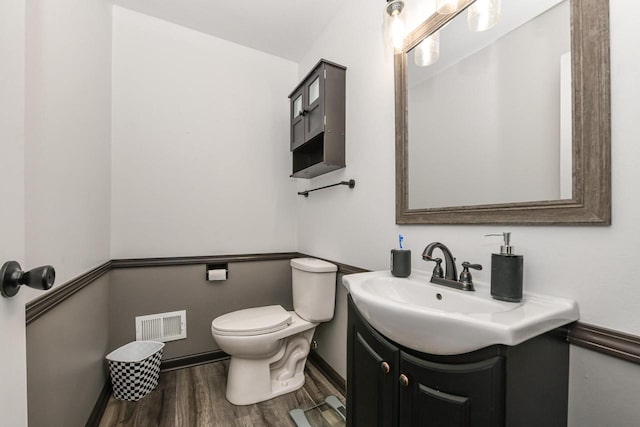 6913 Butternut Rd, Racine, WI 53402 - half bath featuring vanity and wood finished floors