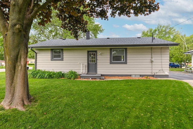 6913 Butternut Rd, Racine, WI 53402 - ranch-style home with a front yard, a chimney, and a shingled roof