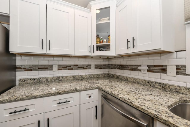 6913 Butternut Rd, Racine, WI 53402 - kitchen featuring dishwasher, white cabinetry, tasteful backsplash, and glass insert cabinets