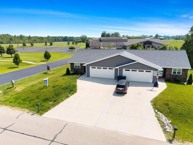 400 Tristan Dr, Shawano, WI 54166 - ranch-style home with an attached garage, driveway, and a front lawn