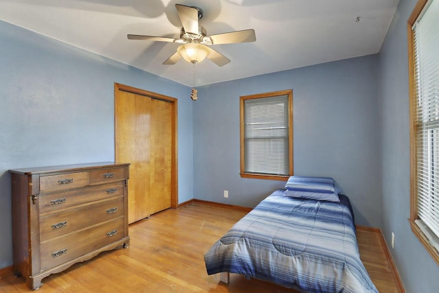7631 38th Ave, Kenosha, WI 53142 - bedroom featuring light wood finished floors, a closet, and ceiling fan