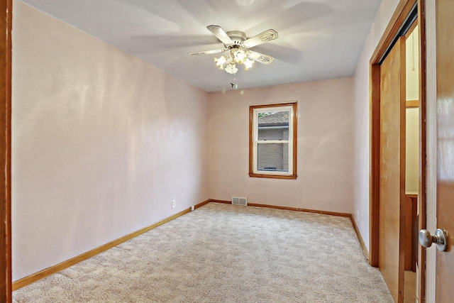 7631 38th Ave, Kenosha, WI 53142 - unfurnished bedroom featuring carpet floors, a closet, and a ceiling fan