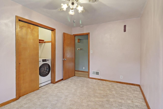 7631 38th Ave, Kenosha, WI 53142 - spare room with washer / clothes dryer, ceiling fan, and carpet flooring