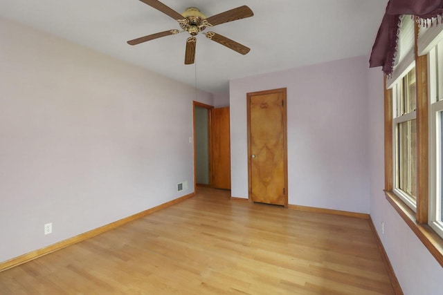 7631 38th Ave, Kenosha, WI 53142 - empty room with light wood-style flooring and ceiling fan