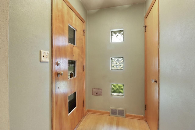 7631 38th Ave, Kenosha, WI 53142 - hallway with light wood-style floors and baseboards