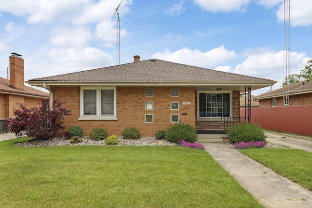 7631 38th Ave, Kenosha, WI 53142 - bungalow with brick siding, roof with shingles, and a chimney