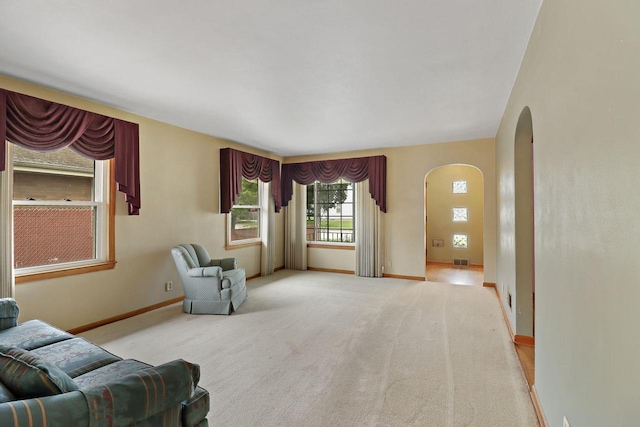 7631 38th Ave, Kenosha, WI 53142 - living room with arched walkways and carpet