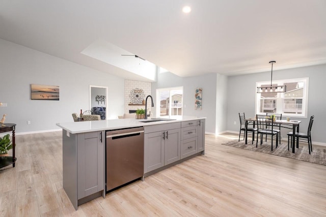 922 Vogt Ln, Chilton, WI 53014 - kitchen with dishwasher, gray cabinets, light countertops, an island with sink, and light wood-type flooring