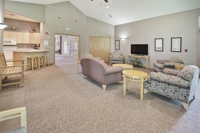 8530 Greenway Blvd Unit 104, Middleton, WI 53562 - living area featuring ceiling fan, light colored carpet, and high vaulted ceiling