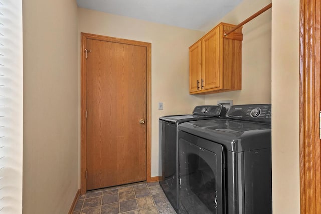 4140 W Lakeview Dr, Franklin, WI 53132 - laundry room featuring independent washer and dryer, cabinet space, and stone finish flooring