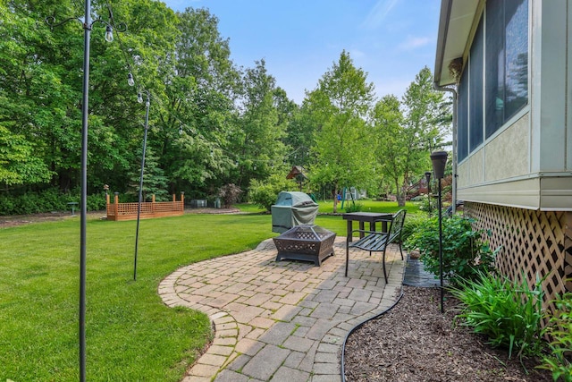 4140 W Lakeview Dr, Franklin, WI 53132 - view of green lawn with an outdoor fire pit, a patio area, and view of scattered trees