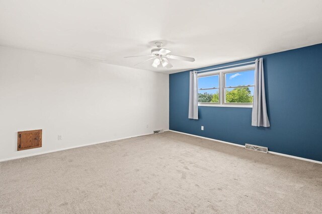 W330S7517 Split Rail Dr, Mukwonago, WI 53149 - carpeted spare room with ceiling fan and baseboards