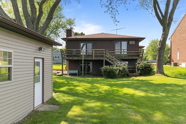 6352 Black Wolf Point Ln, Oshkosh, WI 54902 - rear view of house featuring stairs, a deck, a chimney, and a yard