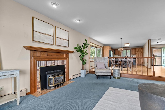 6352 Black Wolf Point Ln, Oshkosh, WI 54902 - carpeted living area featuring a wood stove and a baseboard heating unit