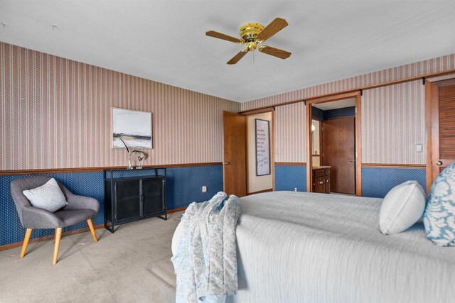 6352 Black Wolf Point Ln, Oshkosh, WI 54902 - bedroom with wallpapered walls, carpet flooring, wainscoting, and ceiling fan