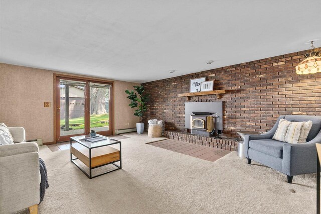 6352 Black Wolf Point Ln, Oshkosh, WI 54902 - carpeted living room featuring a wood stove, brick wall, a baseboard heating unit, and baseboard heating