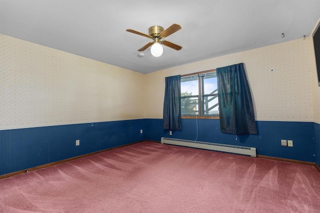 6352 Black Wolf Point Ln, Oshkosh, WI 54902 - empty room featuring baseboard heating, wallpapered walls, ceiling fan, carpet, and wainscoting