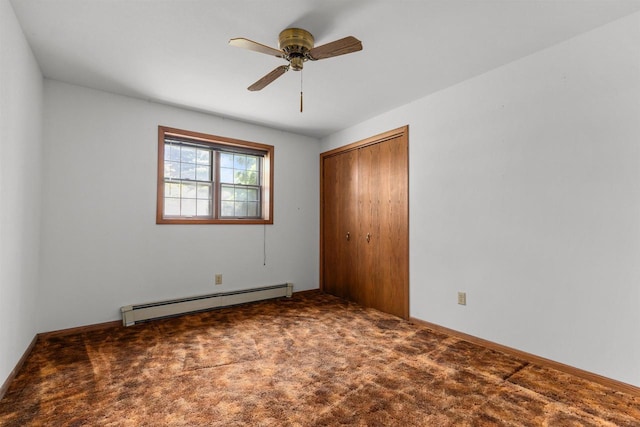6352 Black Wolf Point Ln, Oshkosh, WI 54902 - unfurnished bedroom with a baseboard heating unit, a closet, carpet flooring, and a ceiling fan