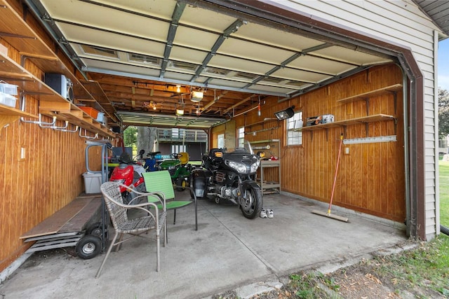6352 Black Wolf Point Ln, Oshkosh, WI 54902 - garage featuring wood walls and a garage door opener