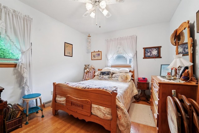 38 Bowen St, Oshkosh, WI 54901 - bedroom with wood finished floors and a ceiling fan