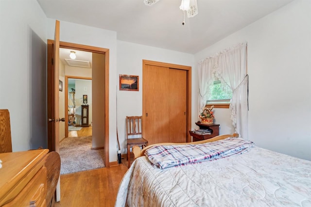 38 Bowen St, Oshkosh, WI 54901 - bedroom with wood finished floors, a closet, and a ceiling fan