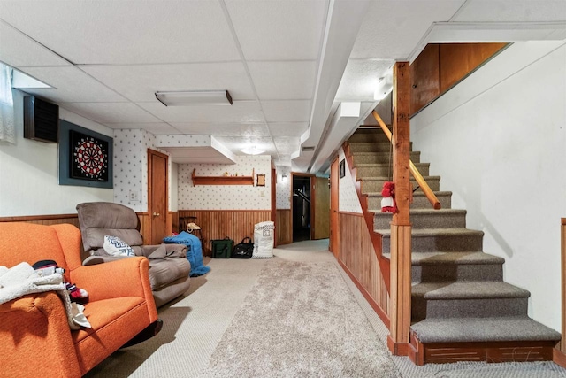 38 Bowen St, Oshkosh, WI 54901 - finished basement with a wainscoted wall, carpet floors, stairway, wooden walls, and a drop ceiling