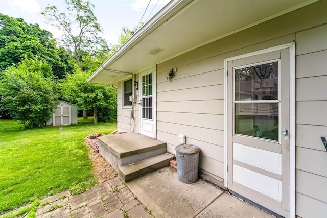 38 Bowen St, Oshkosh, WI 54901 - property entrance with a lawn