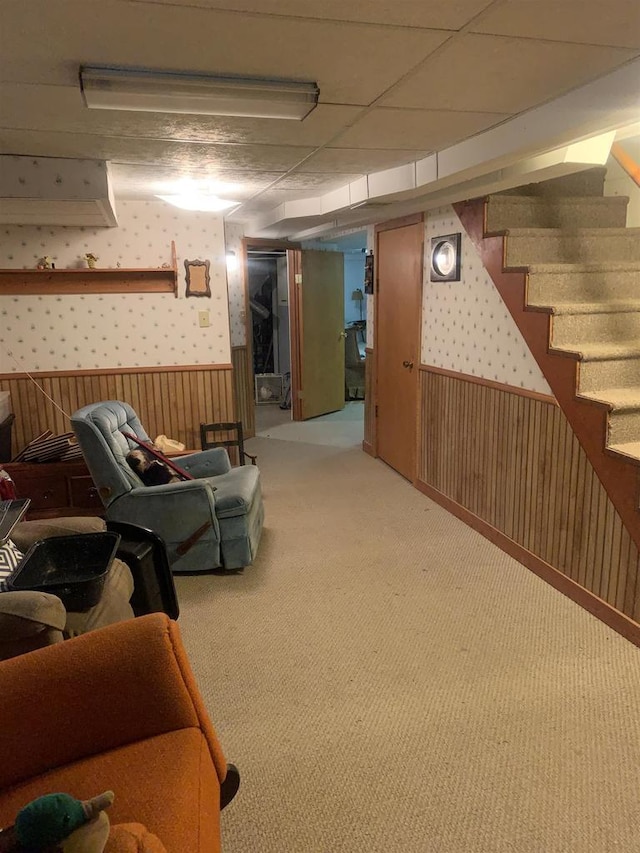 38 Bowen St, Oshkosh, WI 54901 - finished below grade area featuring wallpapered walls, wainscoting, stairs, and carpet