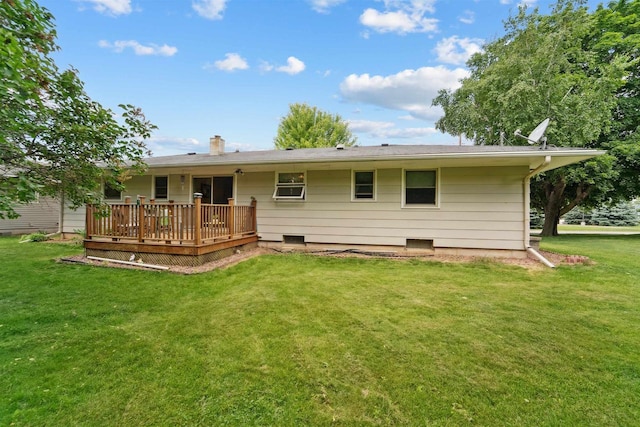 38 Bowen St, Oshkosh, WI 54901 - back of property featuring a wooden deck, a lawn, and a chimney