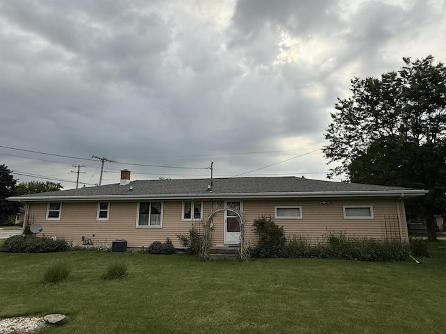 317 Reed St, Chilton, WI 53014 - rear view of property with a yard and a chimney