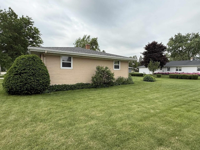 317 Reed St, Chilton, WI 53014 - view of home's exterior with a yard and a chimney