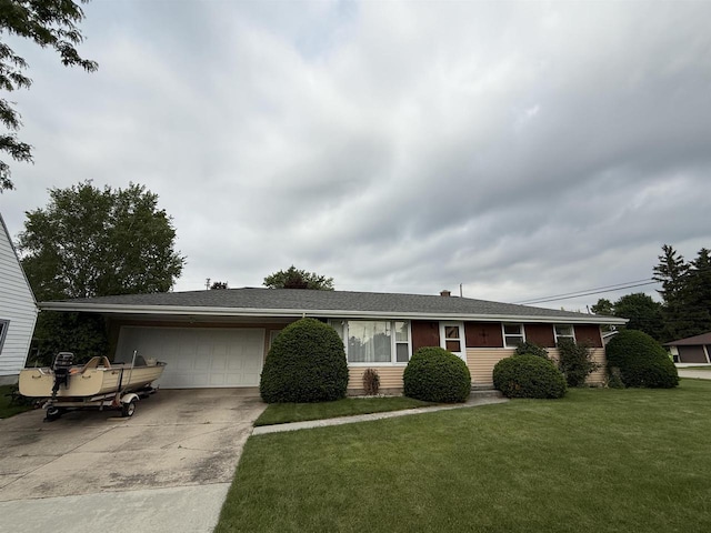317 Reed St, Chilton, WI 53014 - ranch-style house with a garage, concrete driveway, and a front yard