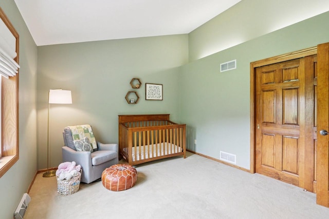 W151N10146 W Windsong Cir, Germantown, WI 53022 - bedroom with a baseboard radiator, carpet flooring, and lofted ceiling
