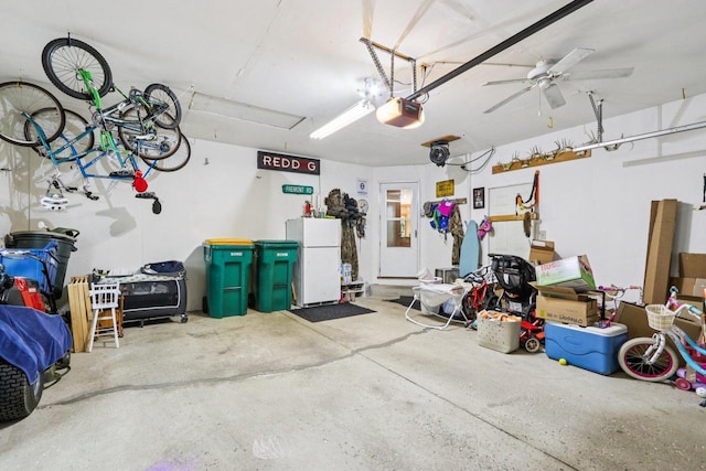 W151N10146 W Windsong Cir, Germantown, WI 53022 - garage with freestanding refrigerator and a garage door opener