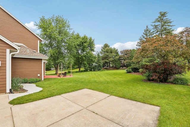 W151N10146 W Windsong Cir, Germantown, WI 53022 - view of grassy yard with a patio and view of scattered trees