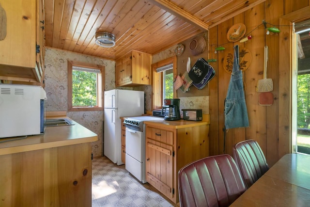 N14066 Squaw Creek Rd, Wausaukee, WI 54177 - kitchen with white appliances, wallpapered walls, light flooring, light countertops, and wood ceiling