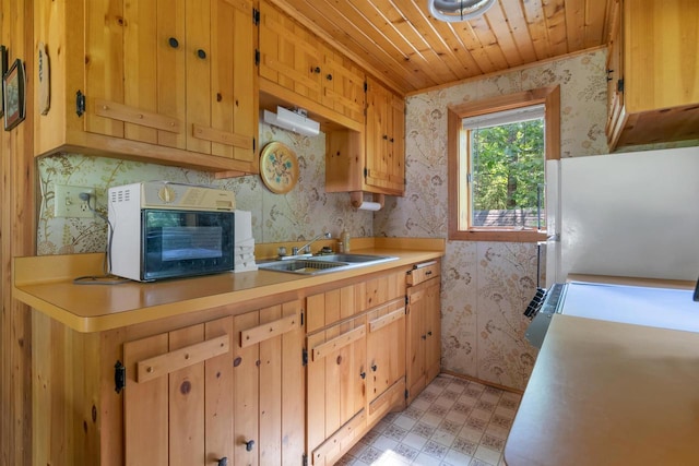 N14066 Squaw Creek Rd, Wausaukee, WI 54177 - kitchen with wallpapered walls, light flooring, freestanding refrigerator, light countertops, and wooden ceiling
