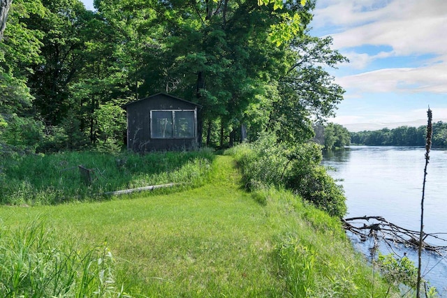 N14066 Squaw Creek Rd, Wausaukee, WI 54177 - view of yard with a water view and a storage unit