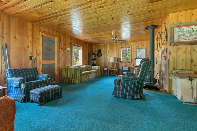 N14066 Squaw Creek Rd, Wausaukee, WI 54177 - carpeted living area featuring wooden walls, a ceiling fan, and wood ceiling