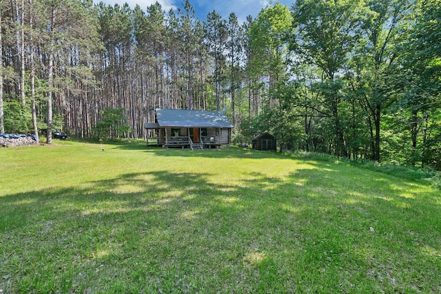 N14066 Squaw Creek Rd, Wausaukee, WI 54177 - view of green lawn with an outdoor structure and a view of trees