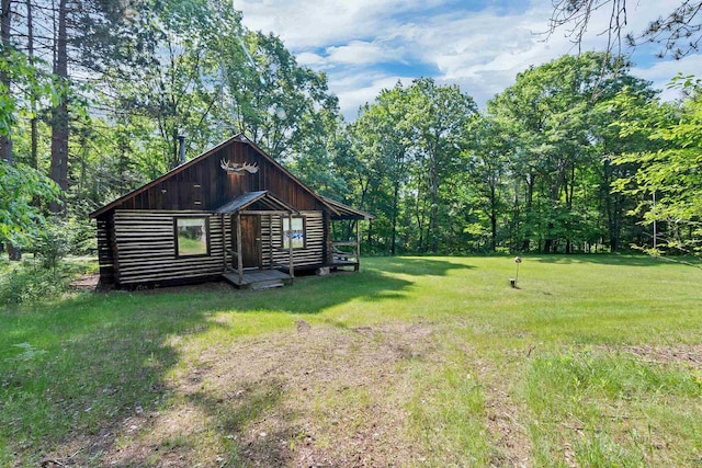 N14066 Squaw Creek Rd, Wausaukee, WI 54177 - rear view of property with a yard, log exterior, and board and batten siding
